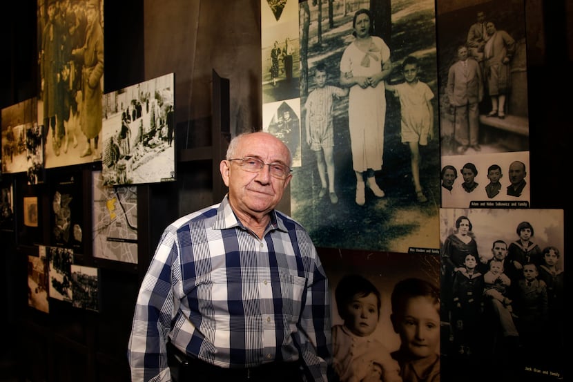 Max Glauben stands in front of some of the photographs taken of him and his mother and...