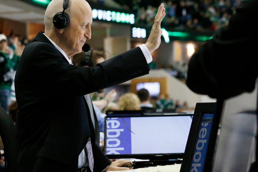 Dallas Stars play-by-play caller, Dave Strader acknowledges the crowd as he is introduced to...