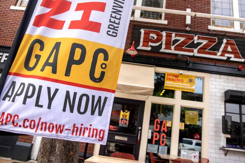 A sign advertises employment opportunities at Greenville Avenue Pizza Company in Dallas on...