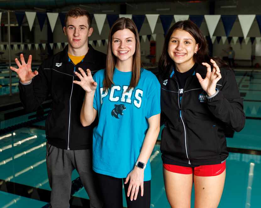 Panther Creek swimmer Aidan Eckard (left) stands with Panther Creek swim coach Megan Conner...