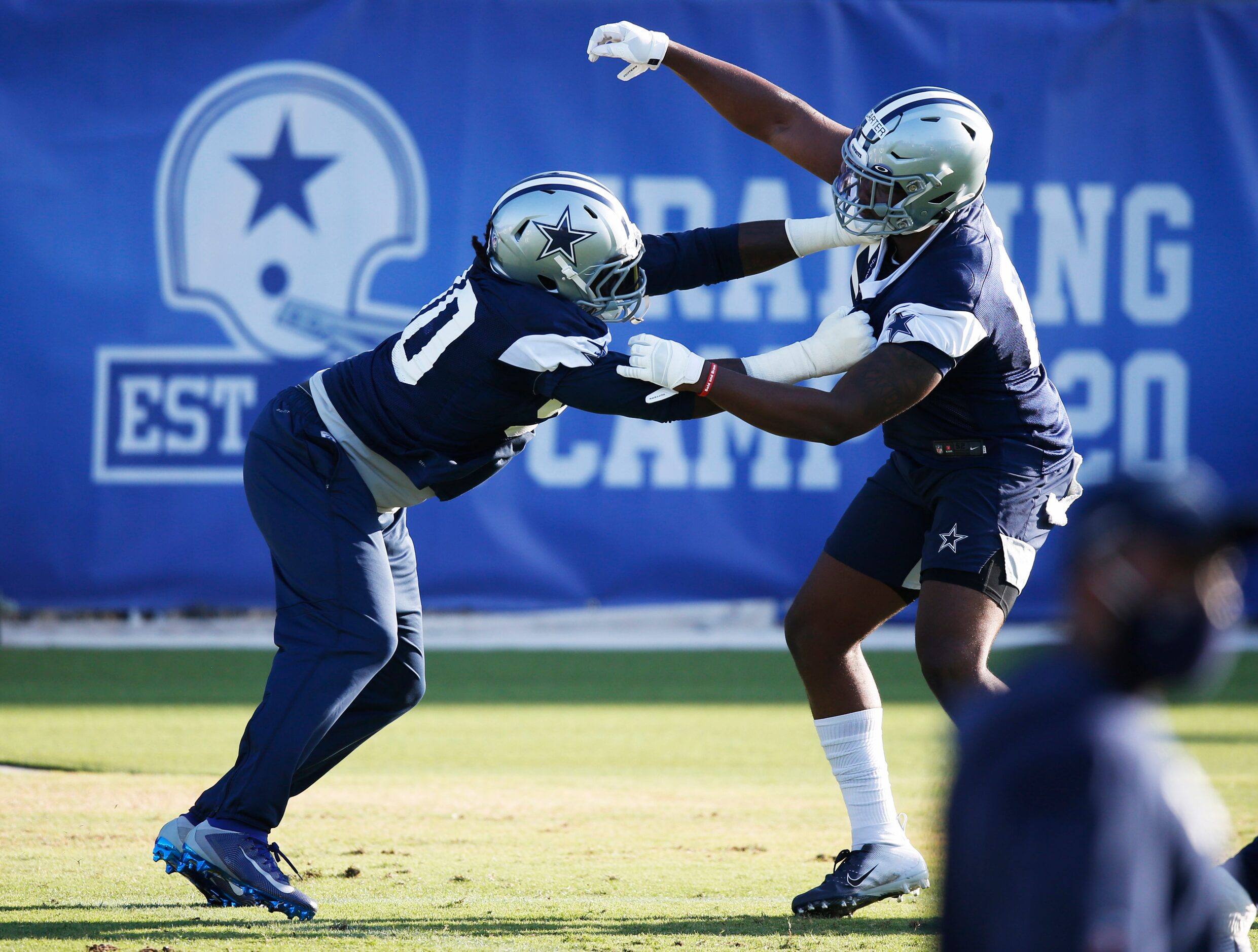 Dallas Cowboys defensive end DeMarcus Lawrence (90) and Dallas Cowboys defensive end...