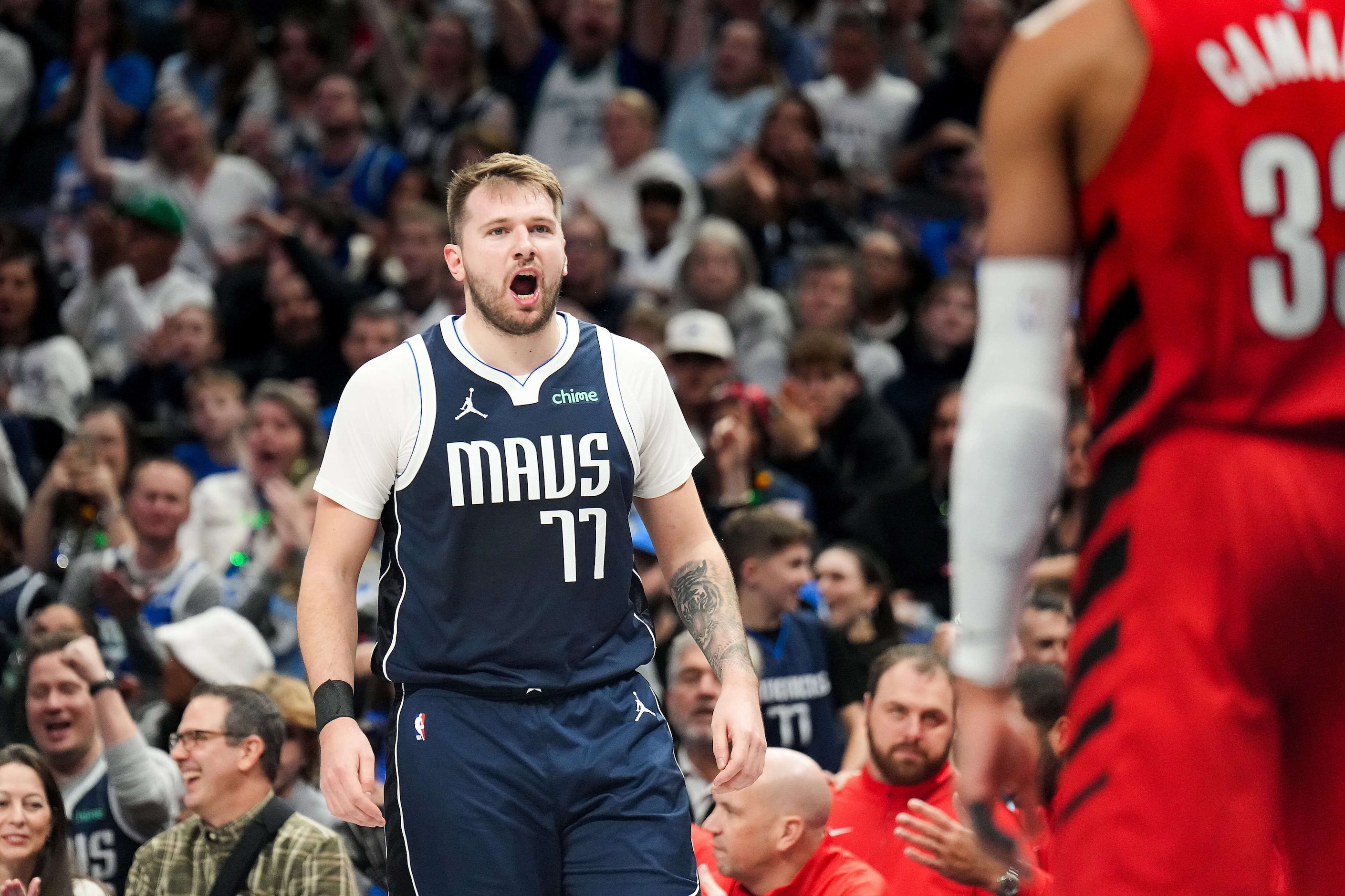 Dallas Mavericks guard Luka Doncic (77) reacts after being fouled by Portland Trail Blazers...