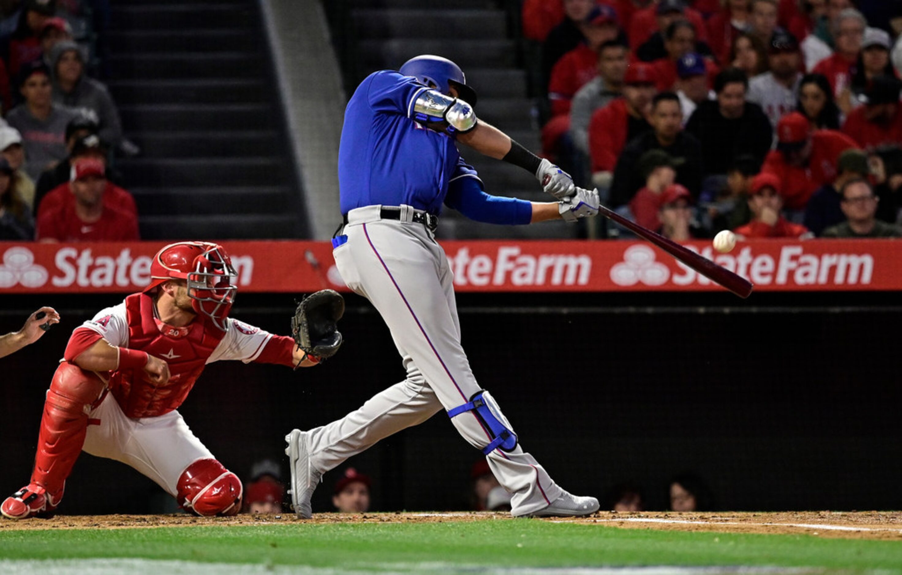 Texas Rangers' Ronald Guzman hits a two-run home run as Los Angeles Angels catcher Jonathan...