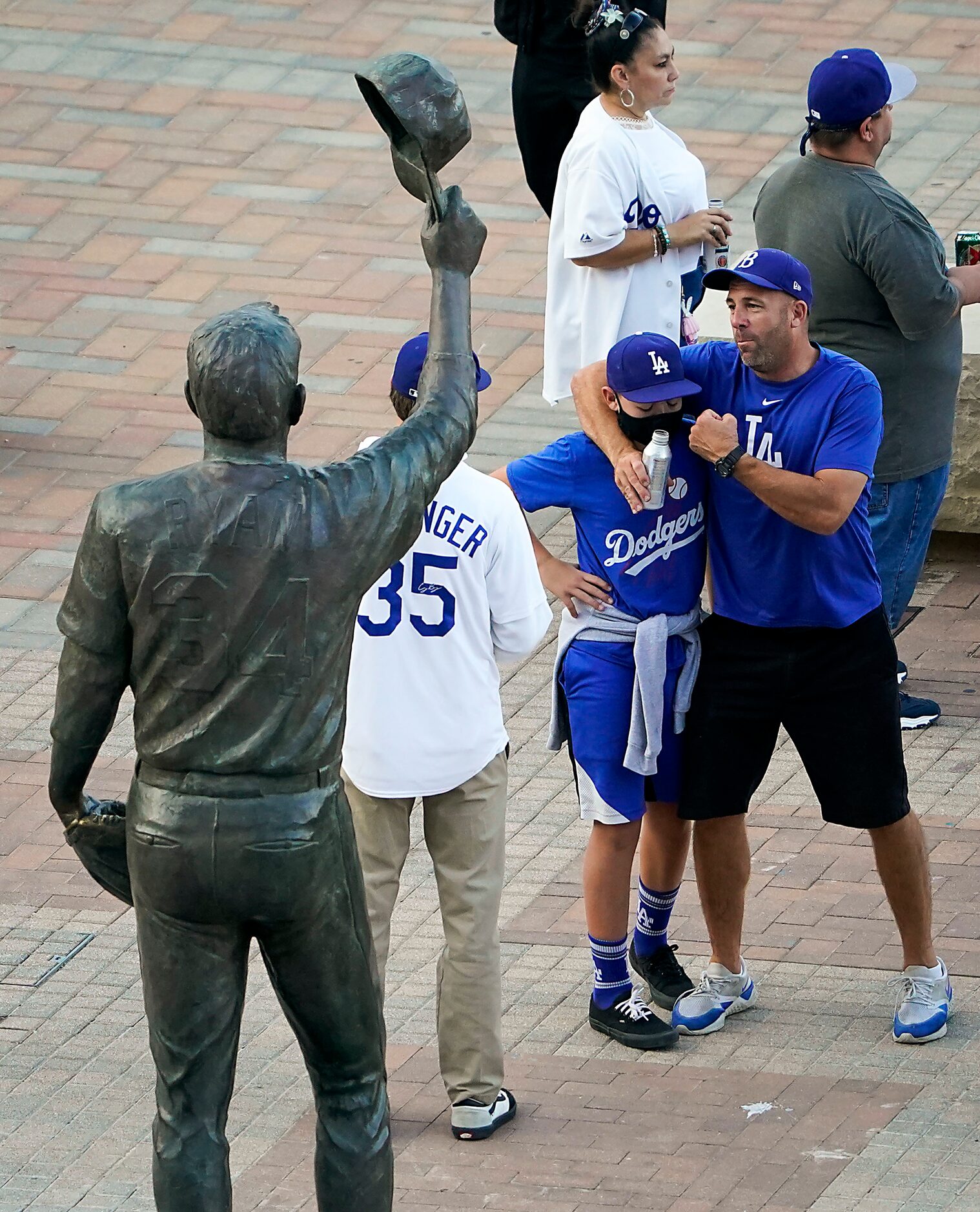 A Los Angeles Dodgers fan mimics the famous fight between Nolan Ryan and Robin Ventura while...