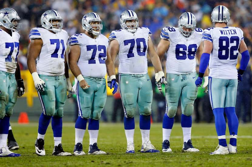 The Dallas Cowboys offensive line including, tackle Tyron Smith (77), offensive guard La'el...