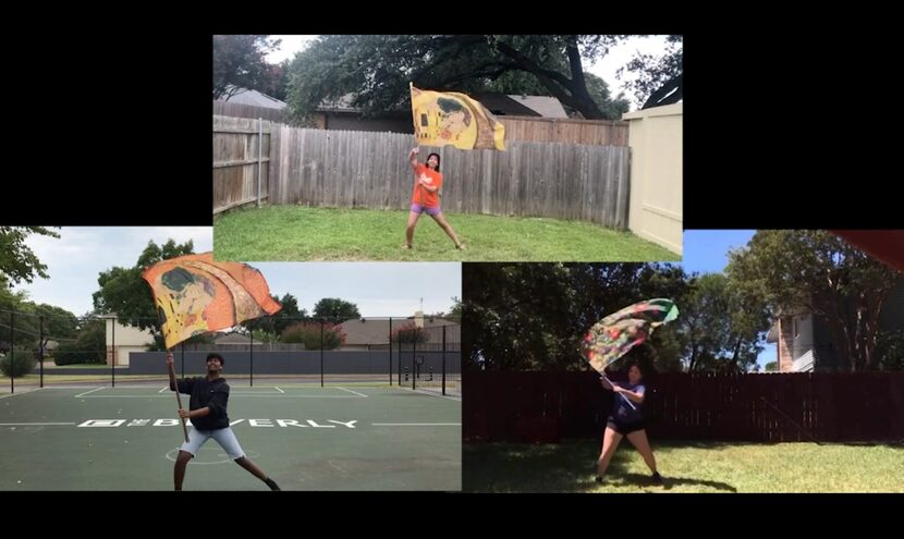 Three of the color guard members in the Berkner High School Mighty Ram Band — from left,...