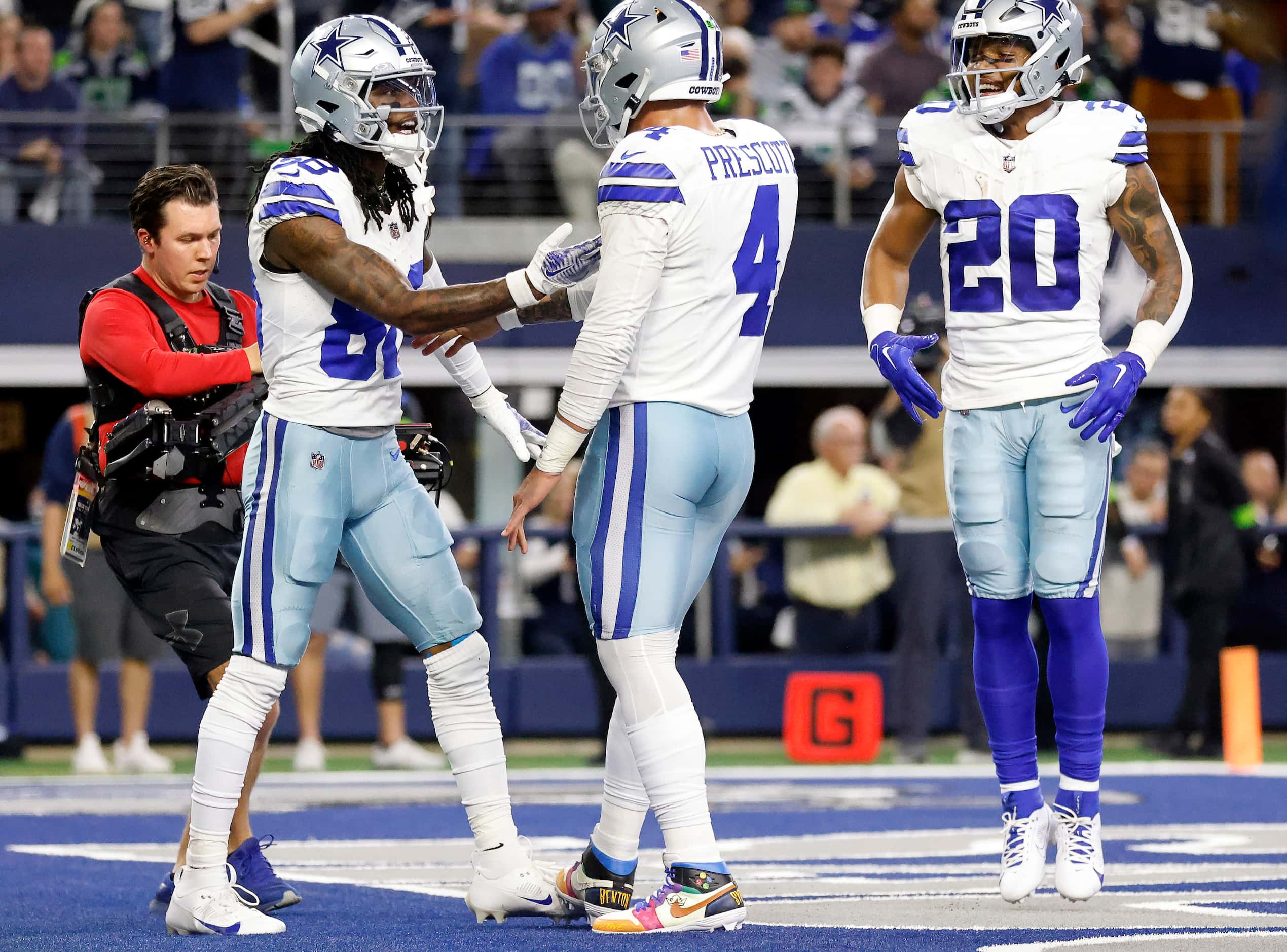 Dallas Cowboys quarterback Dak Prescott (4) congratulates Dallas Cowboys wide receiver...