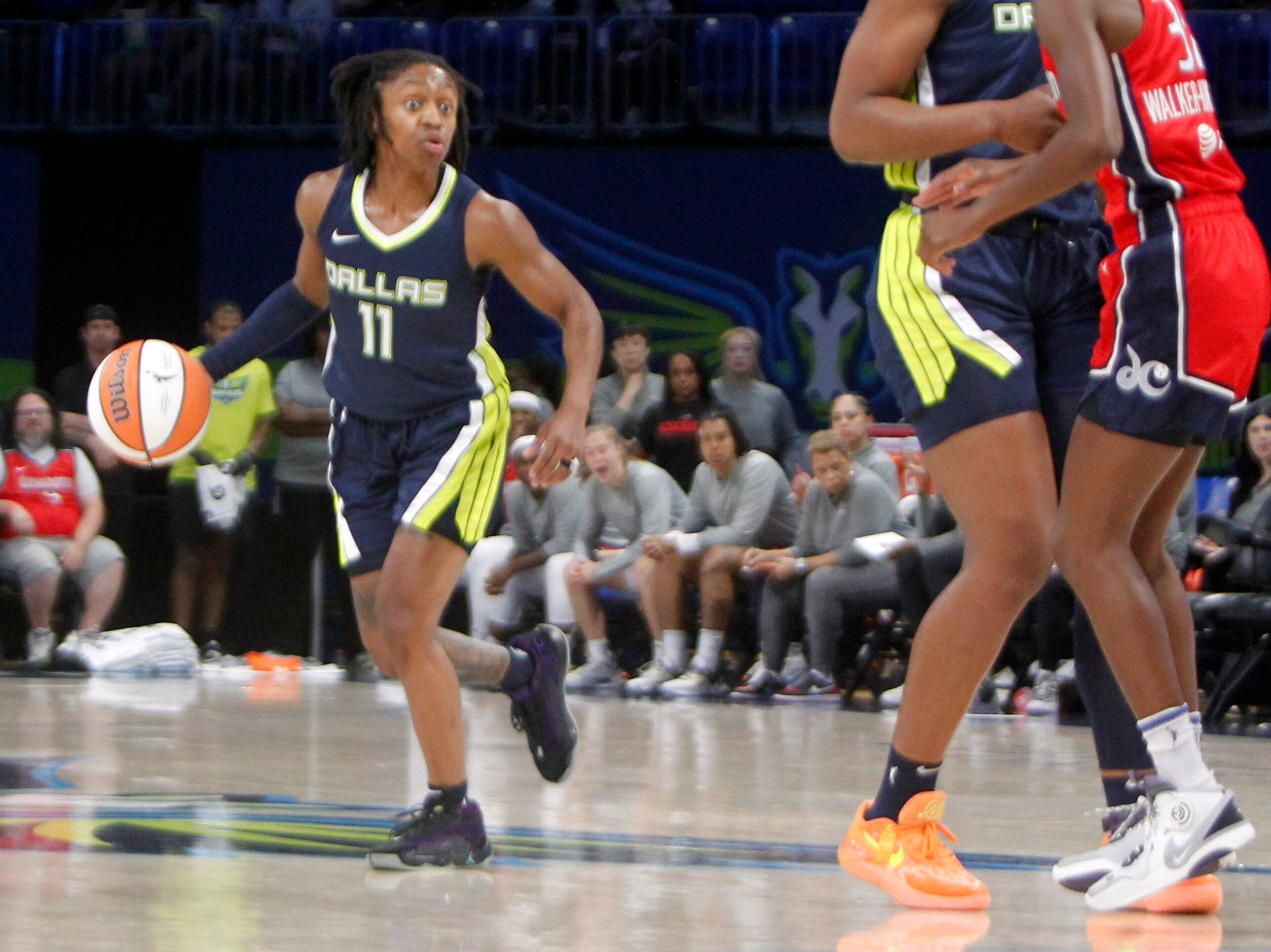 Dallas Wings guard Crystal Dangerfield (11) looks to set up an offensive play during first...