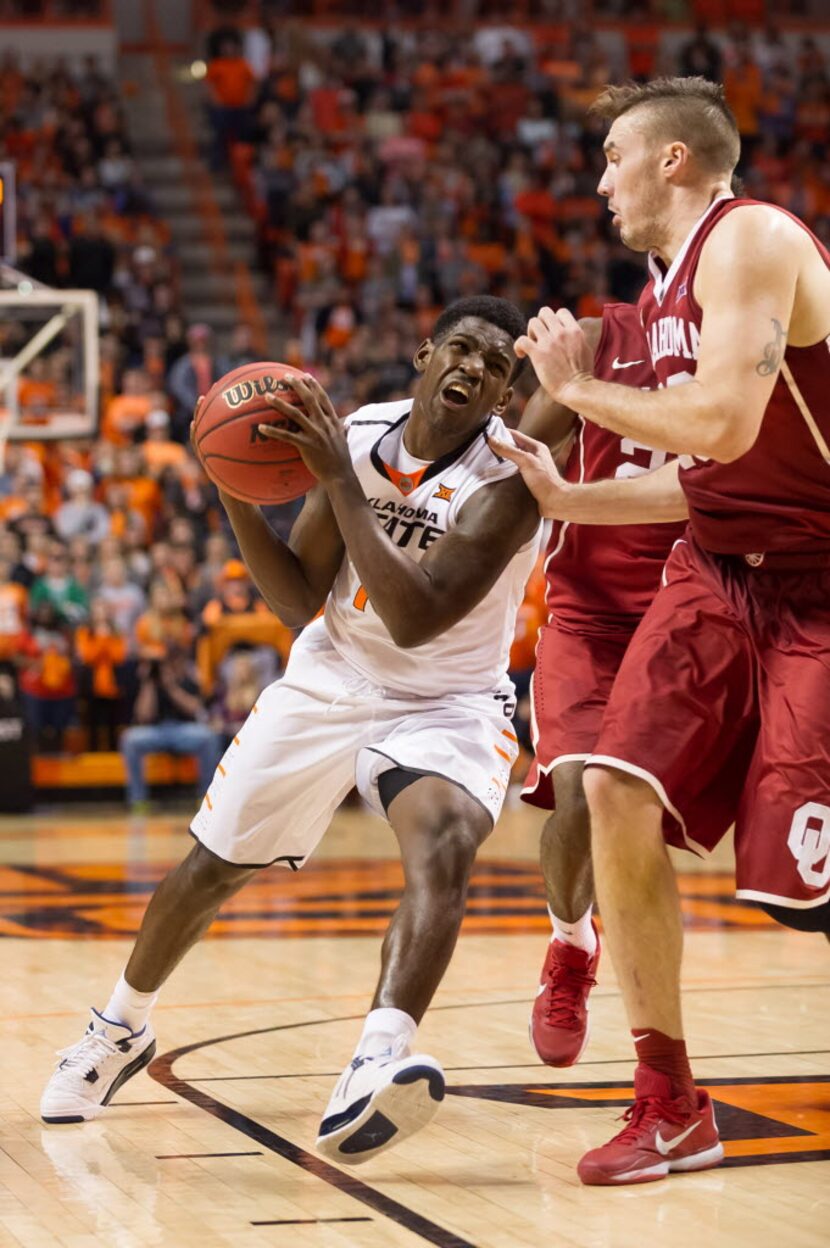 Jan 13, 2016; Stillwater, OK, USA; Oklahoma State Cowboys guard Jawun Evans (1) drives to...