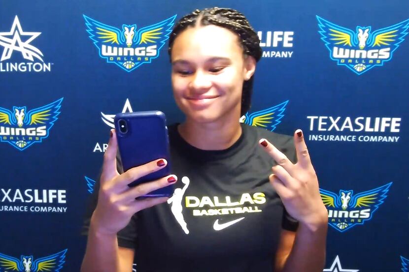 Wings rookie Satou Sabally poses for a selfie before holding a press conference over Zoom...