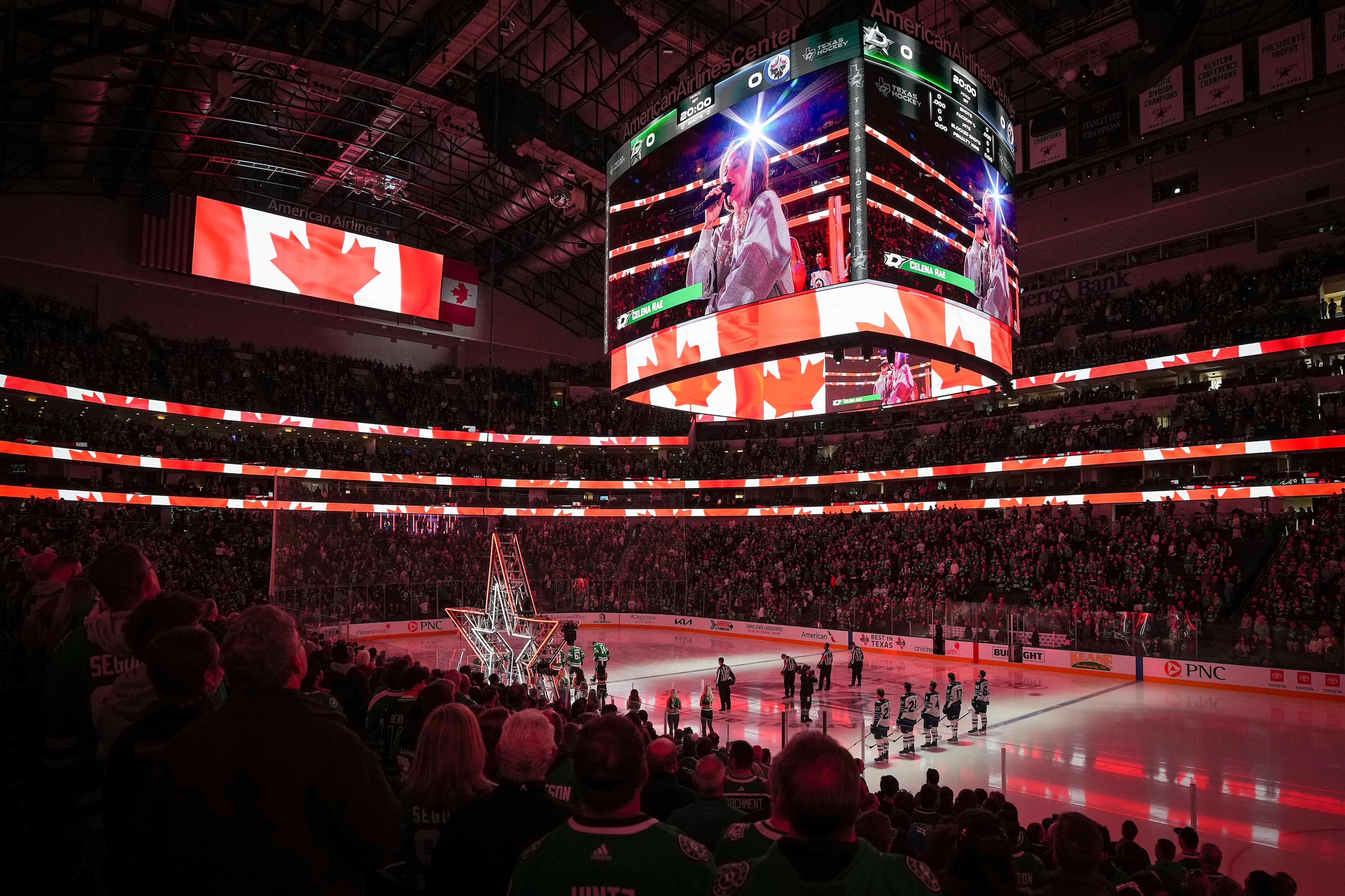 Celena Rae sings “O Canada” before an NHL hockey game between the Dallas Stars and the...