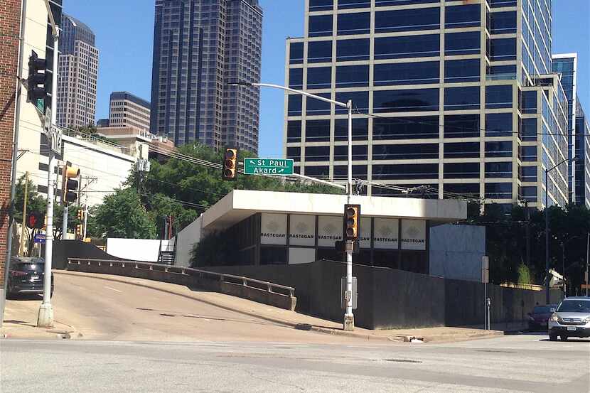 The block at Cedar Springs and St. Paul is occupied by a small commercial building.