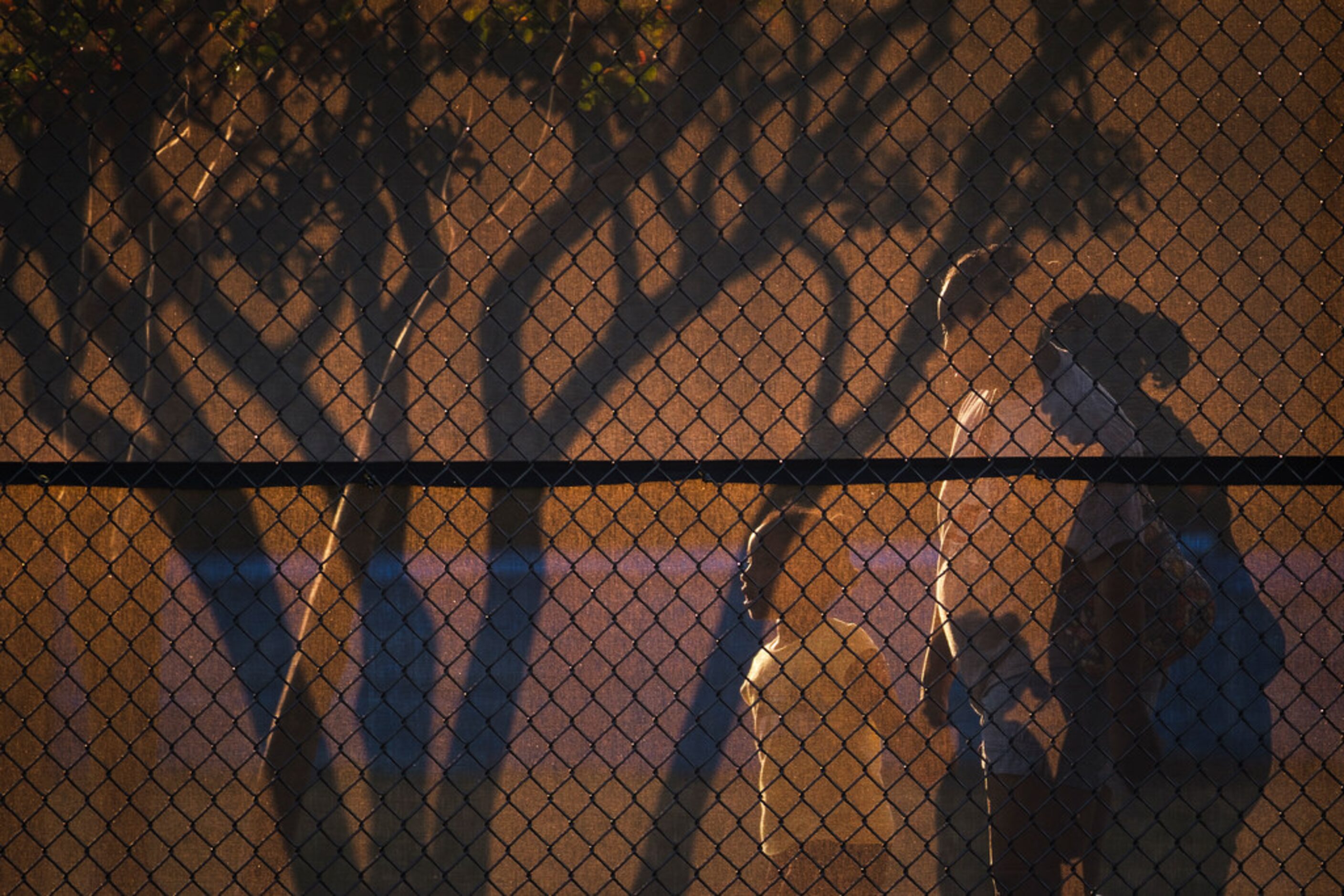 Fans walk outside the stadium from the home side to the overflow visitors side during the...