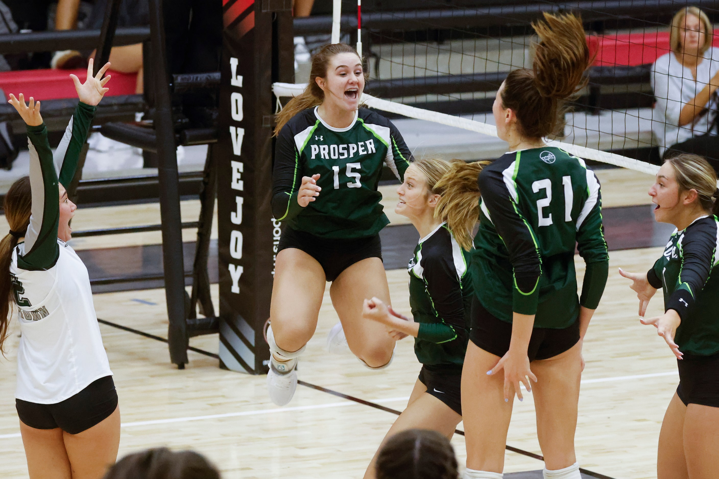 Prosper players including Caroline Collins (15) celebrate a point against Lovejoy during a...