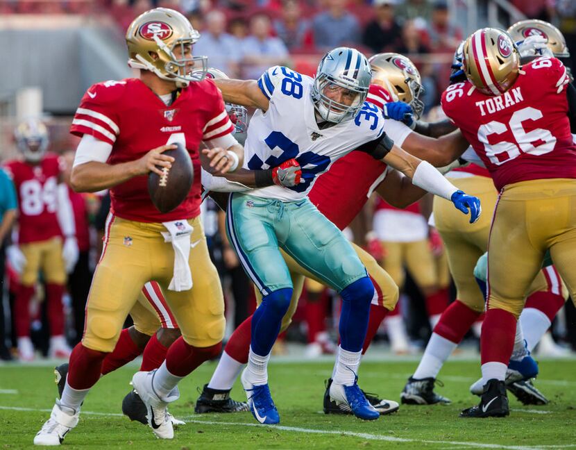 Dallas Cowboys strong safety Jeff Heath (38) looks to sack San Francisco 49ers quarterback...