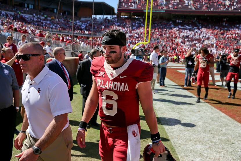 Oklahoma quarterback Baker Mayfield (6) walks off the field after an NCAA college football...