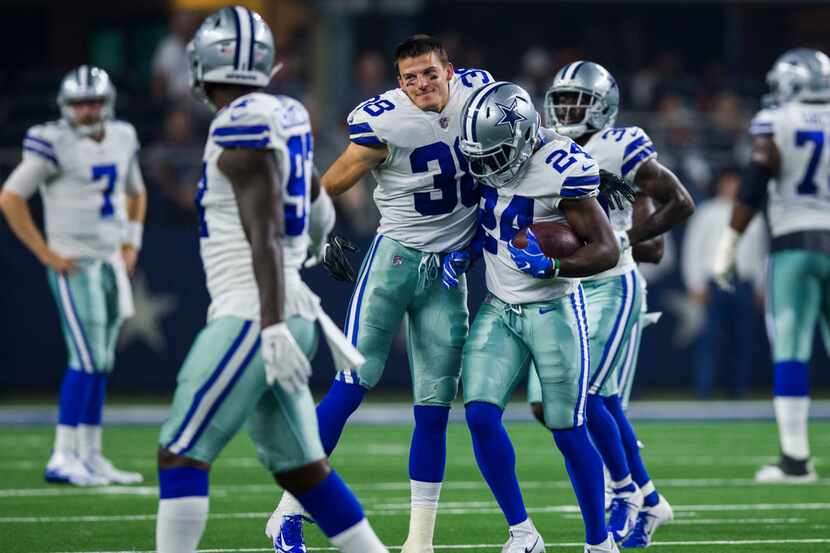 Dallas Cowboys defensive back Jeff Heath (38) celebrates with cornerback Chidobe Awuzie (24)...