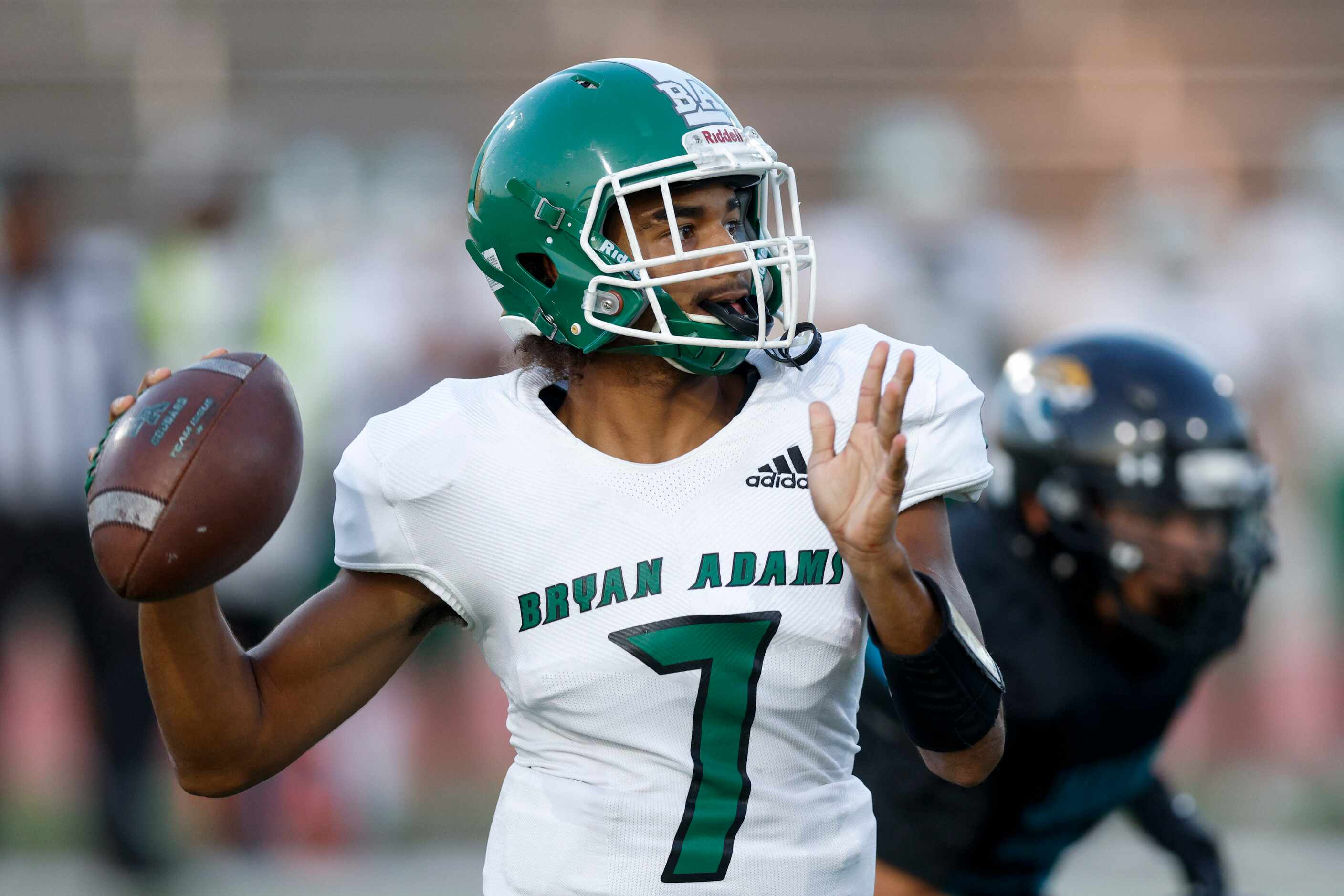 Bryan Adams quarterback Rayvon Jackson Jr. (7) passes the ball during the first half of a...