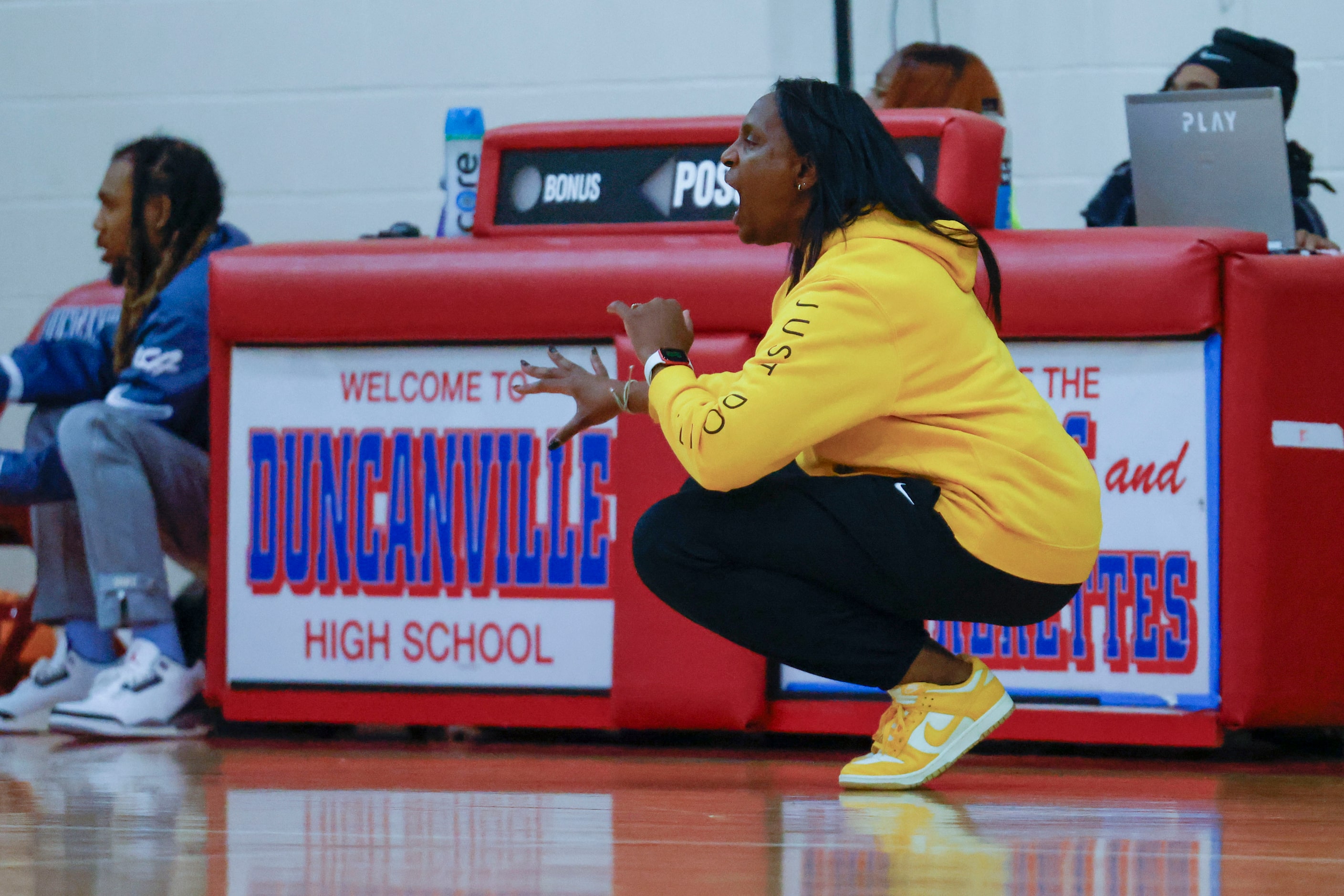 Oak Cliff Faith Family Academy head coach Andrea Robinson instructs the team  during the...