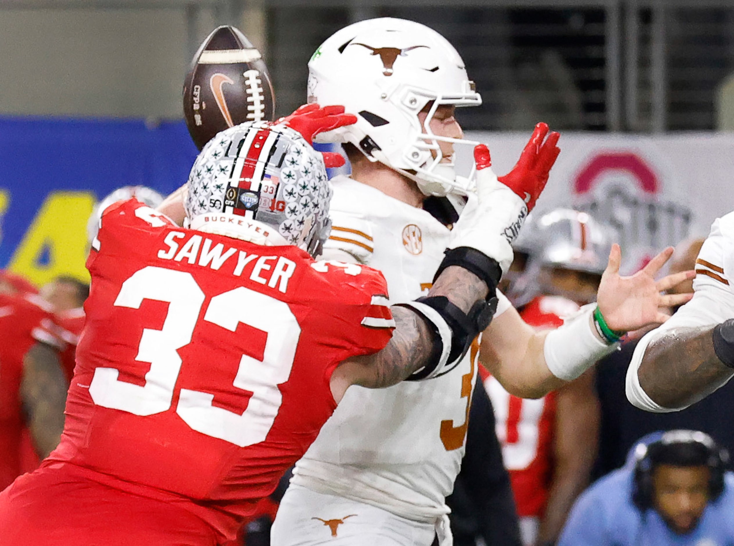 Ohio State Buckeyes defensive end Jack Sawyer (33) knocks the ball from Texas Longhorns...