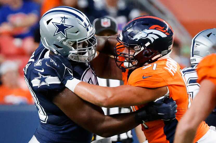 Dallas Cowboys rookie offensive tackle Tyler Smith (73) battles Denver Broncos defensive end...