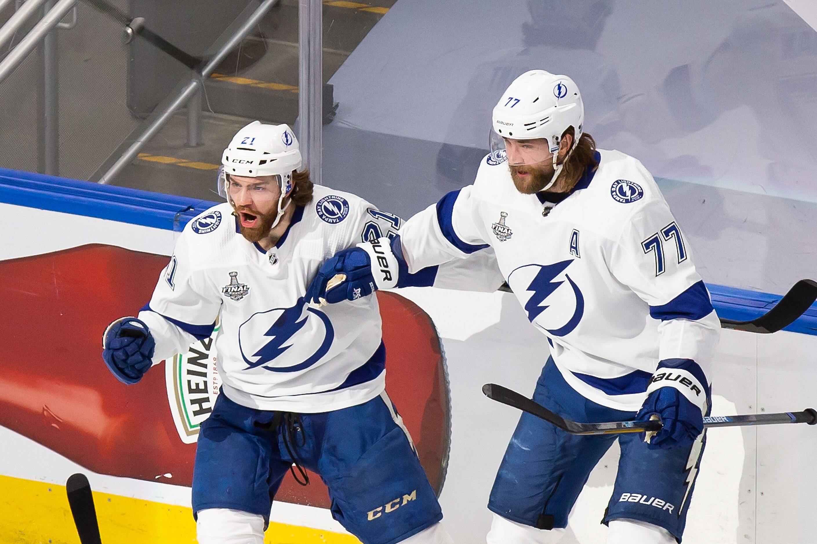 Brayden Point (21) and Victor Hedman (77) of the Tampa Bay Lightning celebrate Point's goal...