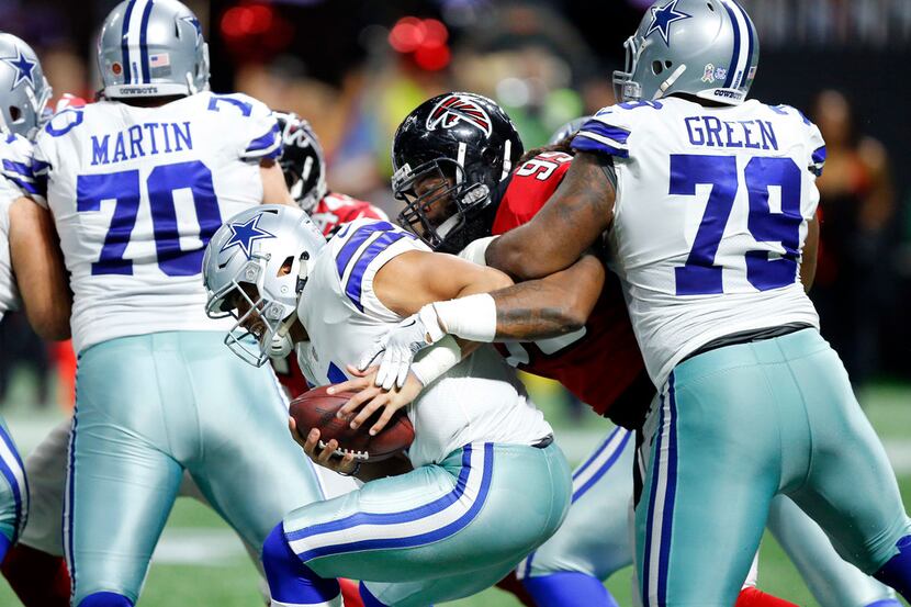 Dallas Cowboys offensive guard Chaz Green (79) tries to keep Atlanta Falcons defensive end...