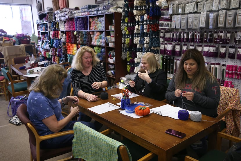 From left, Lee DeVine of Plano, Yarn and Stitches owner Hope Logan, Barbara Thomas and...