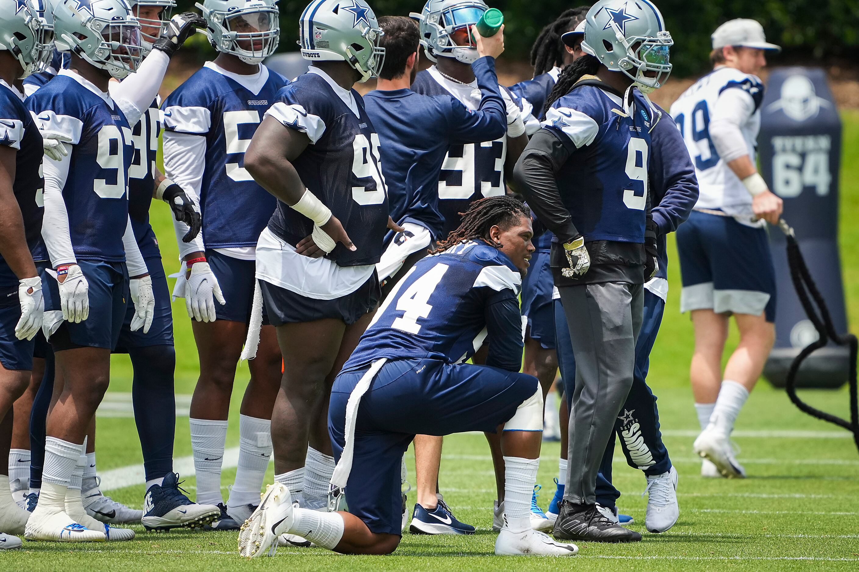 Dallas Cowboys defensive end Randy Gregory (94) takes a knee between drills during a...