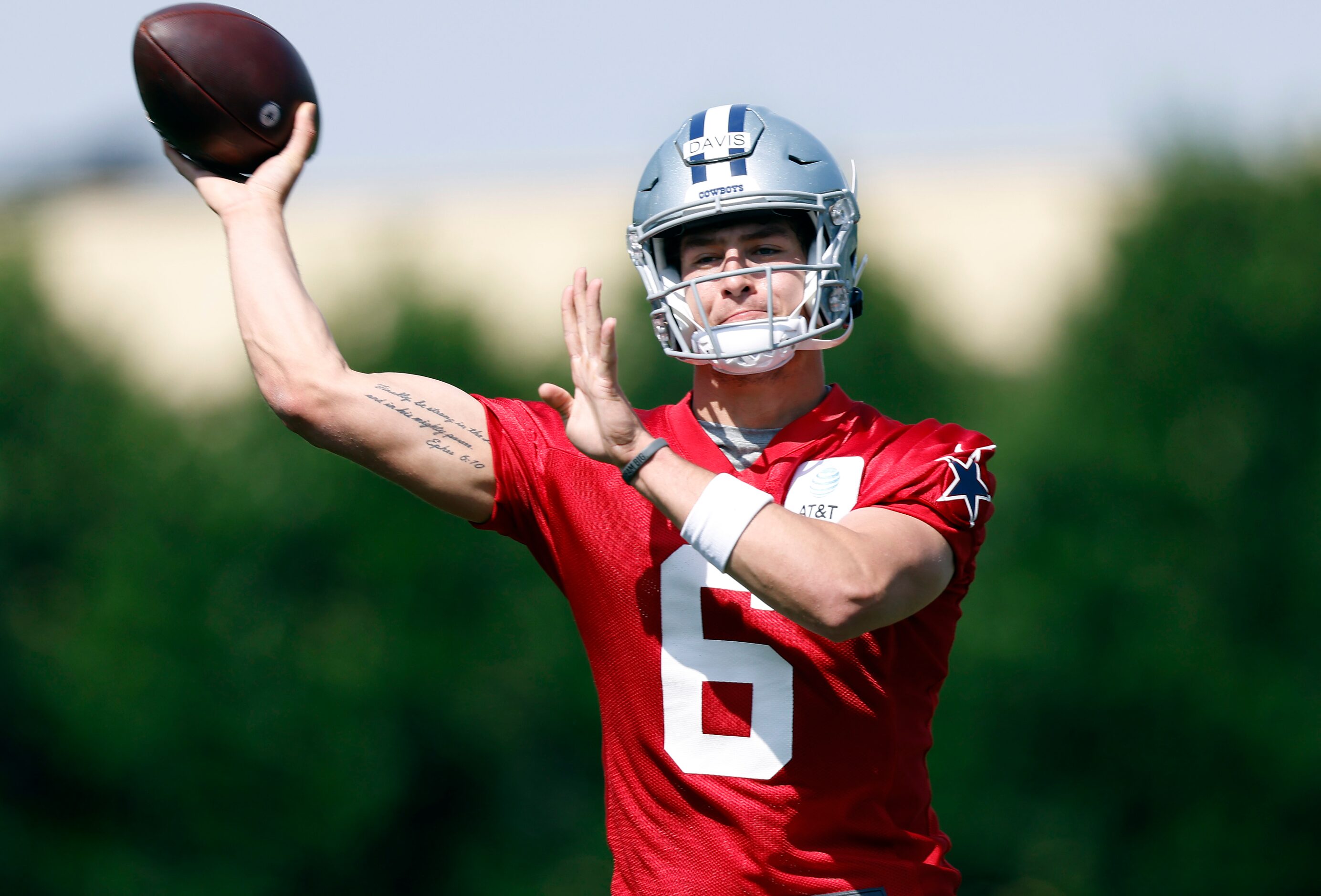 Dallas Cowboys rookie quarterback Brady Davis (6) throws on the run during rookie minicamp...