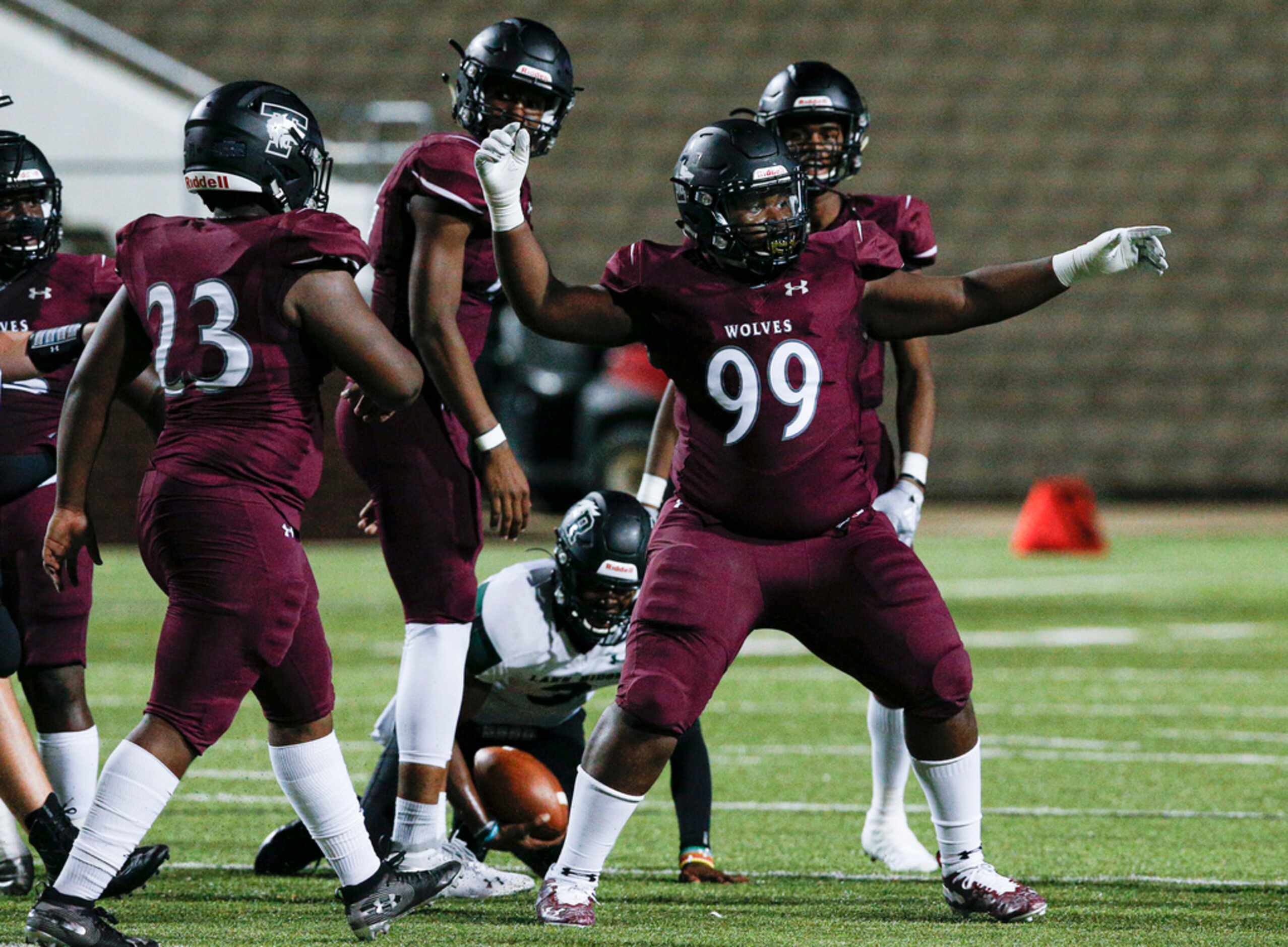 TXHSFB Mansfield Timberview senior defensive lineman Josh Gilliam (99) celebrates sacking...