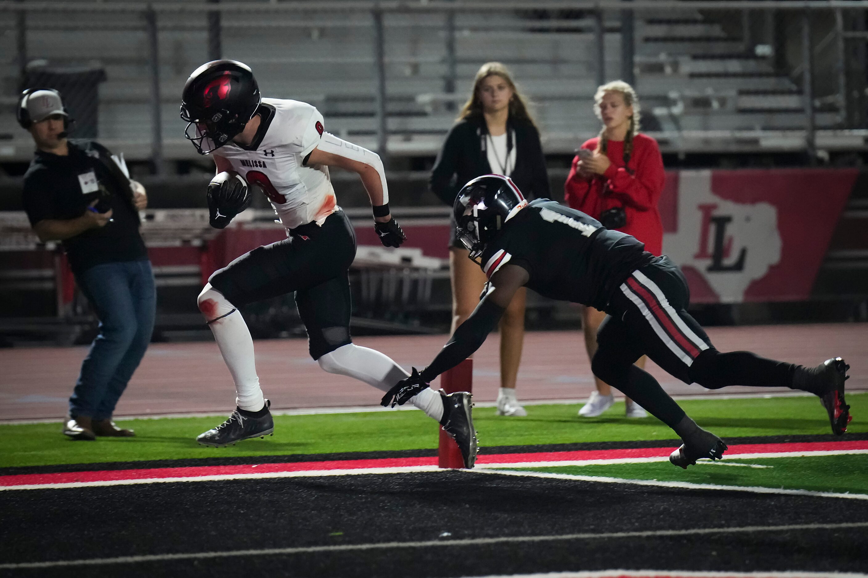 Melissa wide receiver Karson Maynard (9) scores past Lovejoy’s Kyle Parker (1) during the...