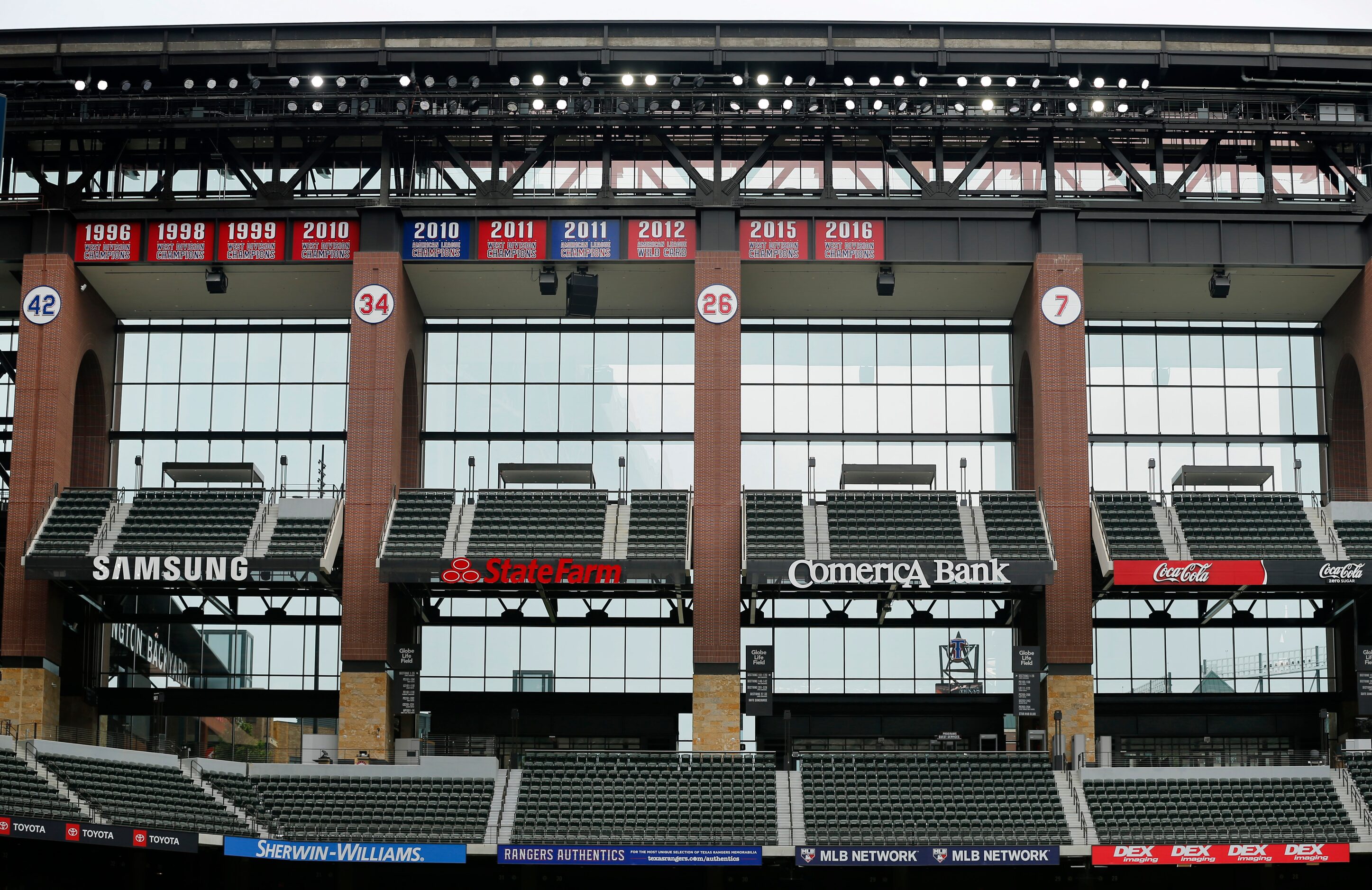 The Texas Rangers pennants hang above the left field seating along with the retired numbers...