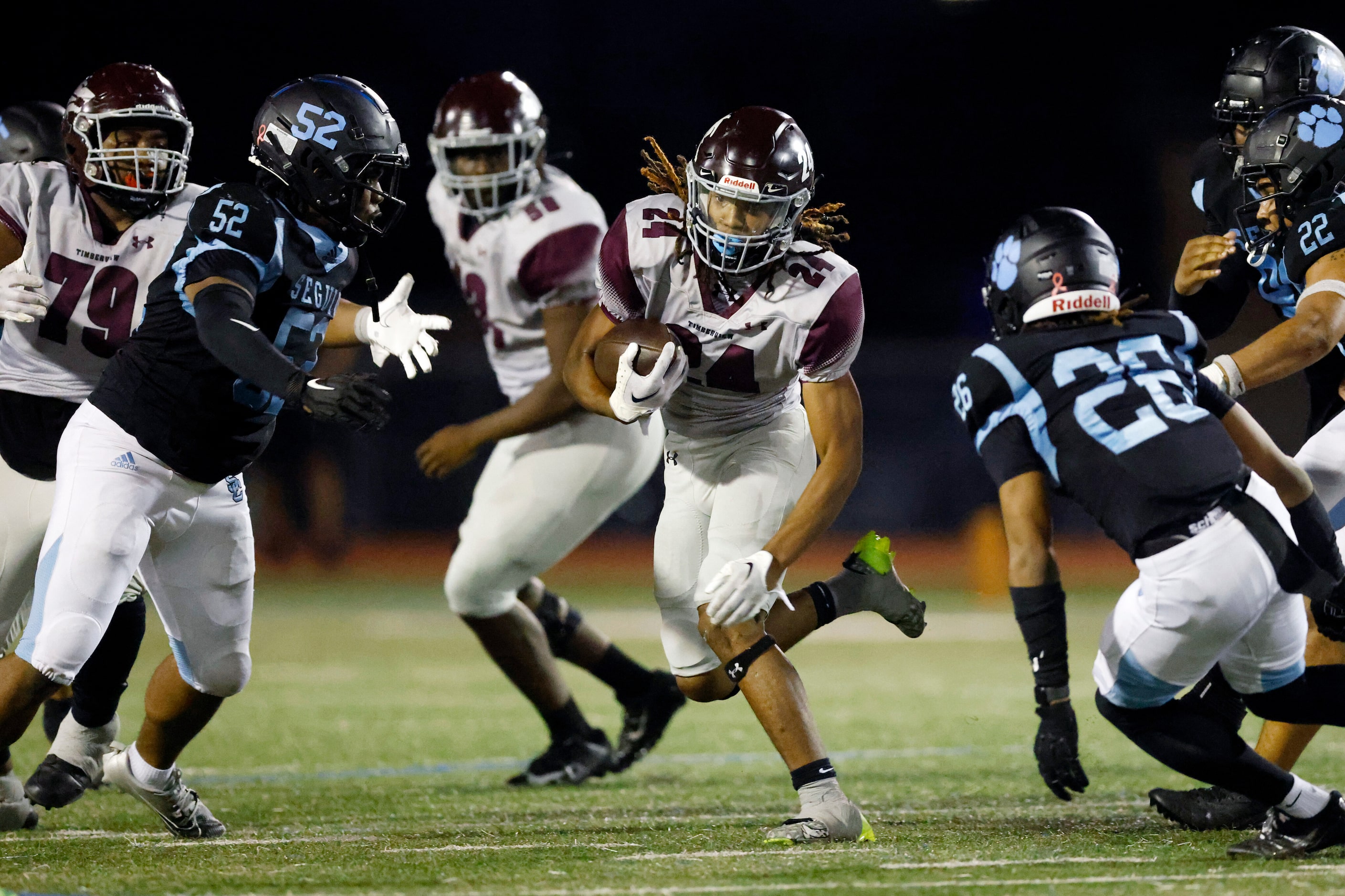 Mansfield Timberview running back Taylor Hanson (24) runs the ball past Arlington Seguin...