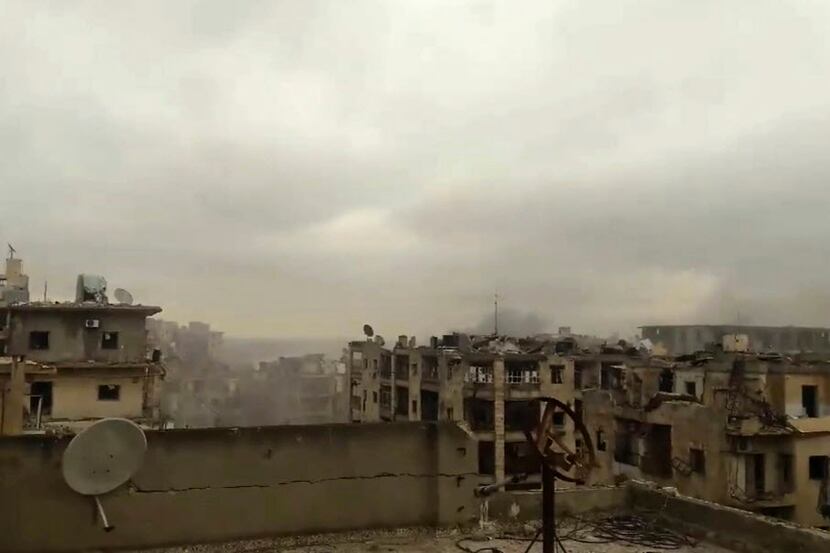 In this still image taken from video released by a Syrian activist Wednesday smoke rises in...