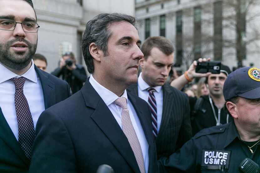 A shell company that Michael Cohen (center) used to pay hush money to a pornographic film...