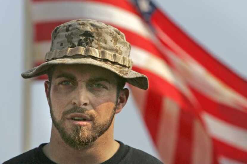 Marine Corps veteran Adam Kokesh talks with reporters during a news conference in Washington...