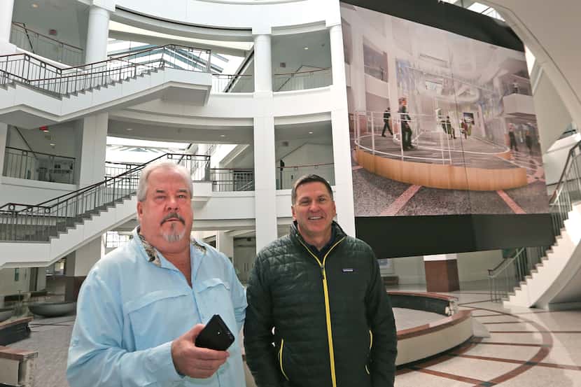 Developer Sam Ware (left) and COO Jeff Blakeley survey the newly-renovated space at the...