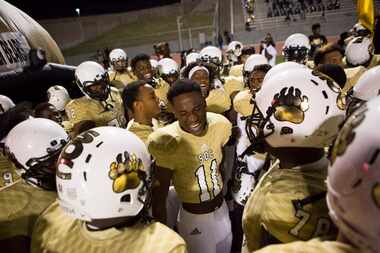 South Oak Cliff chants before taking the field during a District 11-5A matchup between...