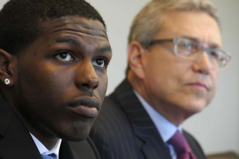 Darius McClinton-Hunter, with attorney Larry Friedman, discussed his lawsuit at a news...
