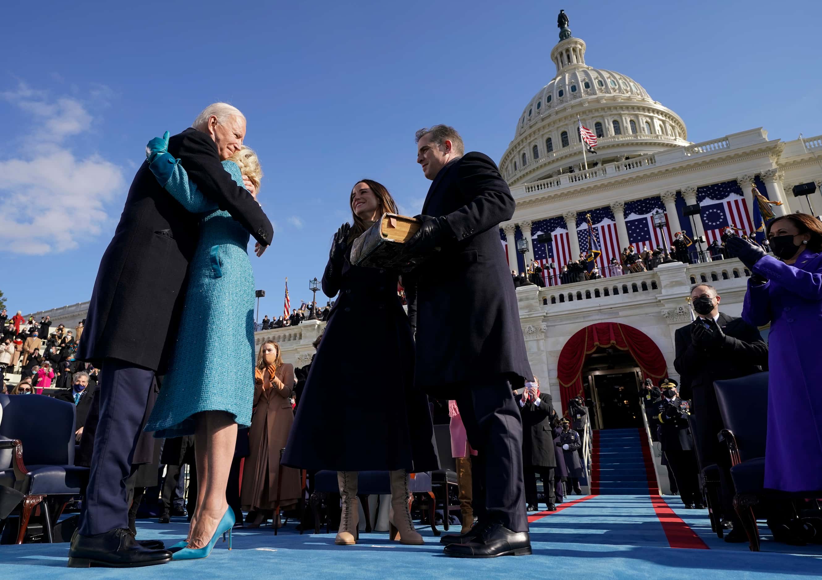 President Joe Biden hugs first lady Jill Biden, as his son Hunter Biden and daughter Ashley...