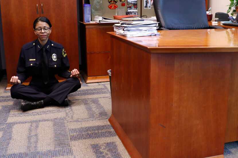 DPD Assistant Chief Tammie Hughes demonstrates how she meditates in her office at the Dallas...