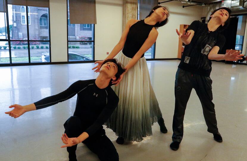 Beijing Dance Theater artistic director Wang Yuanyuan, right, rehearses company members...