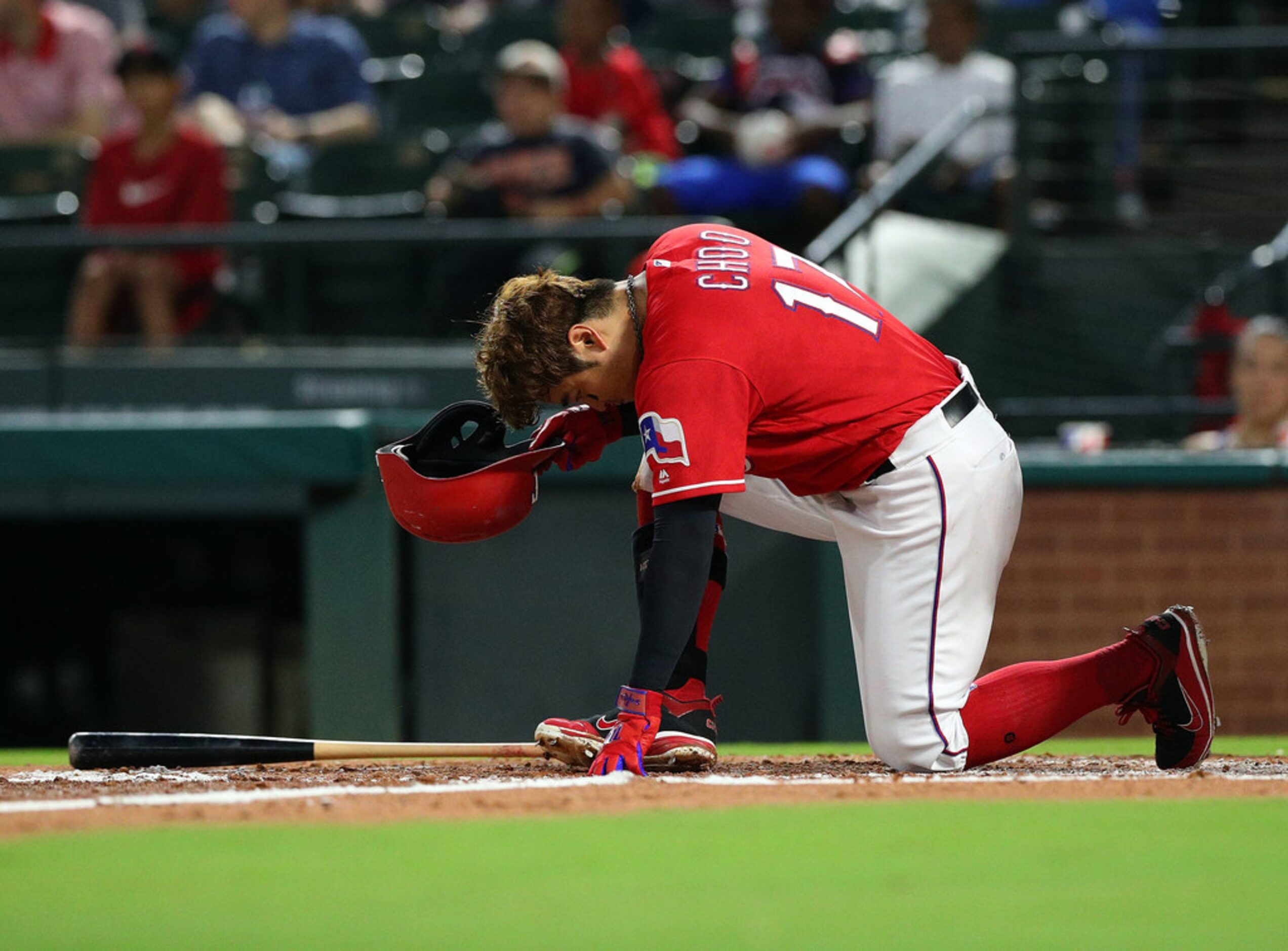 ARLINGTON, TX - SEPTEMBER 03:  Shin-Soo Choo #17 of the Texas Rangers takes a knee after...