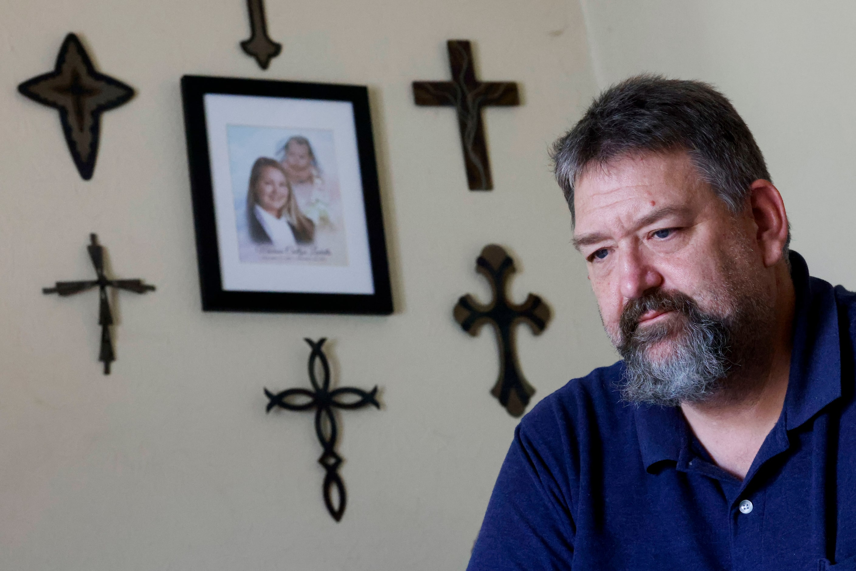 Mark Garbade, Ladatto's stepfather, stares into the distance in his family's Duncanville...