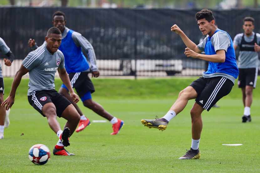 Ricardo Pepi passes the ball past Carlos Gruezo in a combined FC Dallas and North Texas SC...