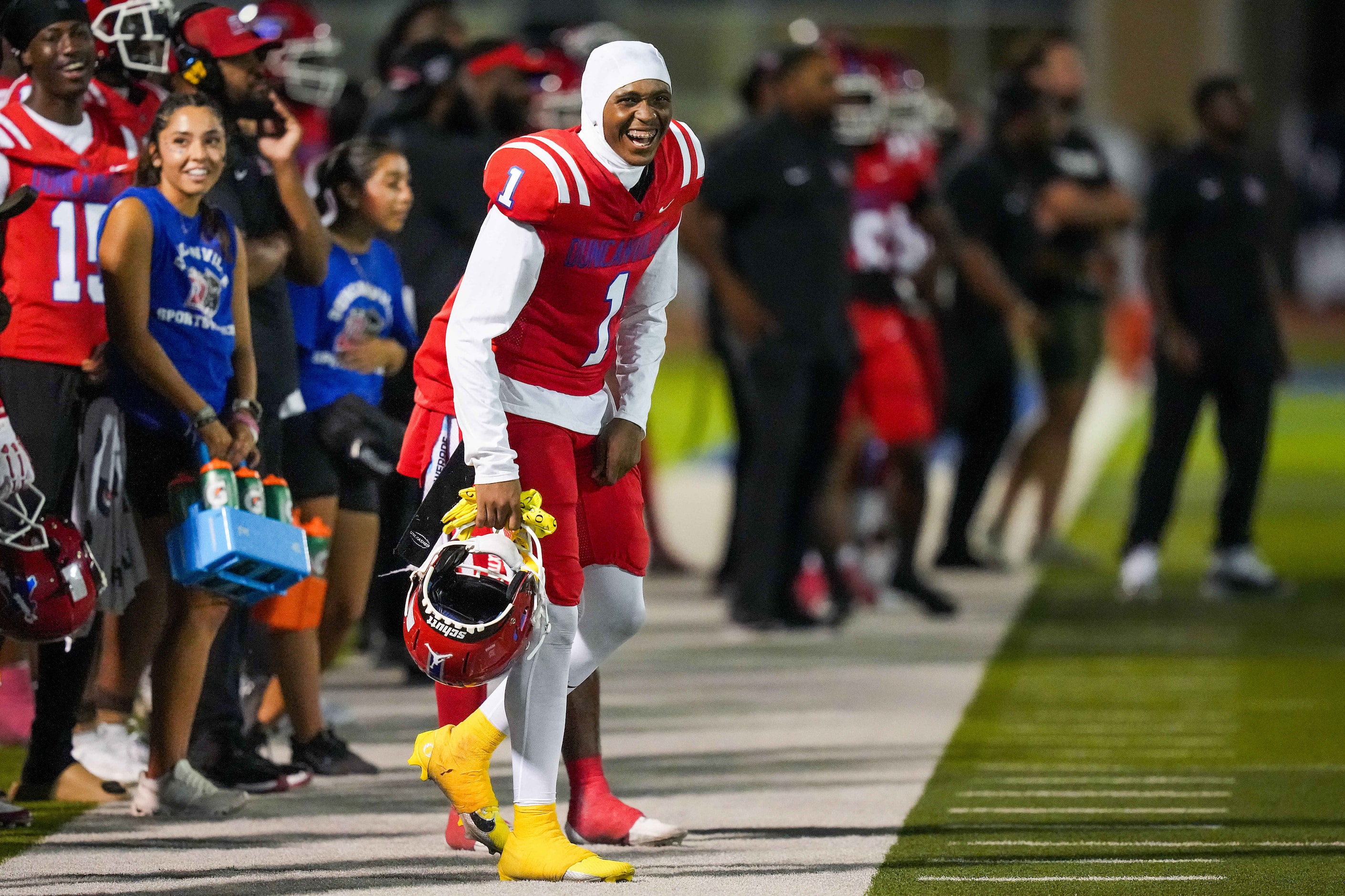 Duncanville wide receiver Dakorien Moore (1) cheers from the sidelines during the second...