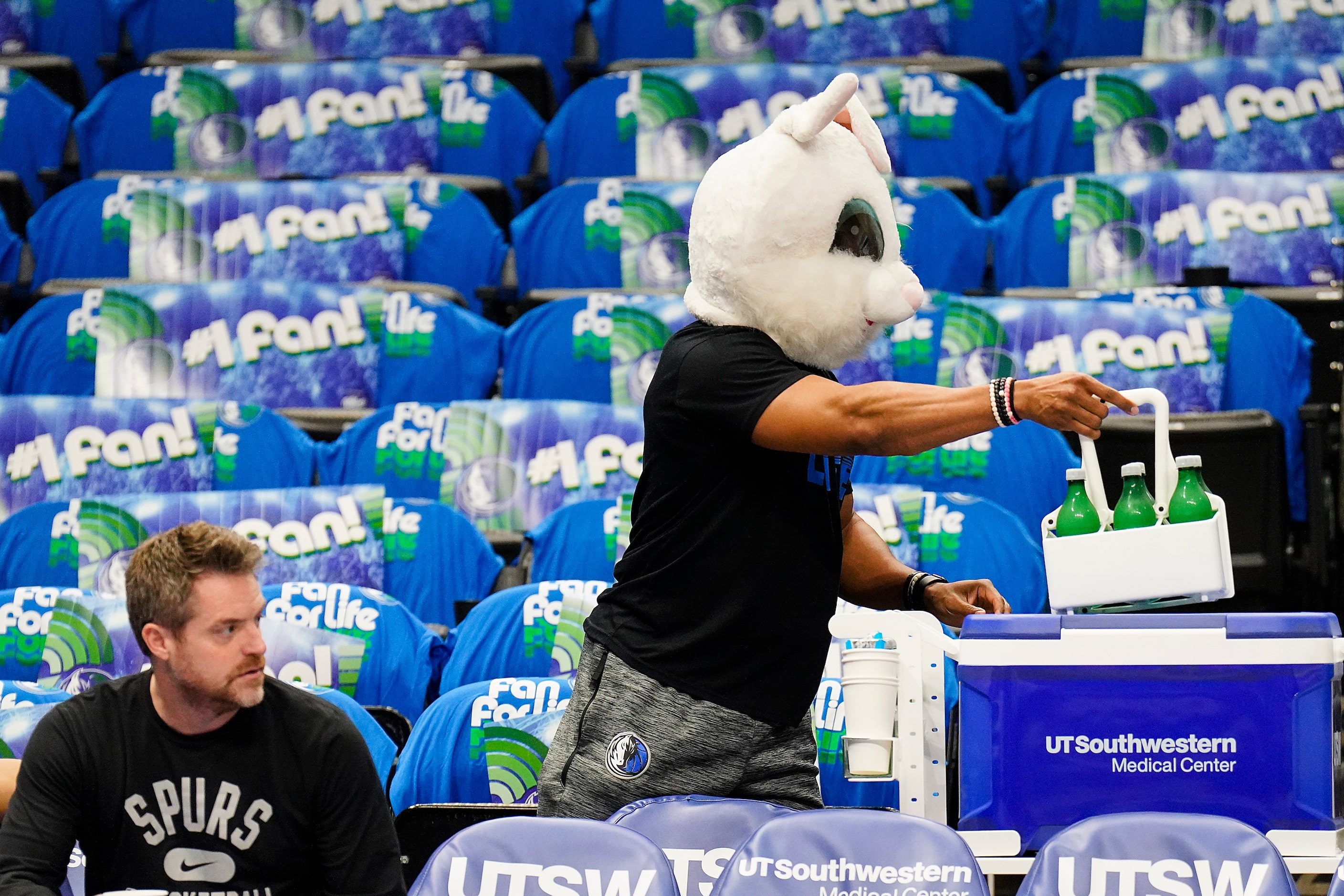 Dallas Mavericks locker room attendant Brandon Dixon wears a bunny head as he prepares the...