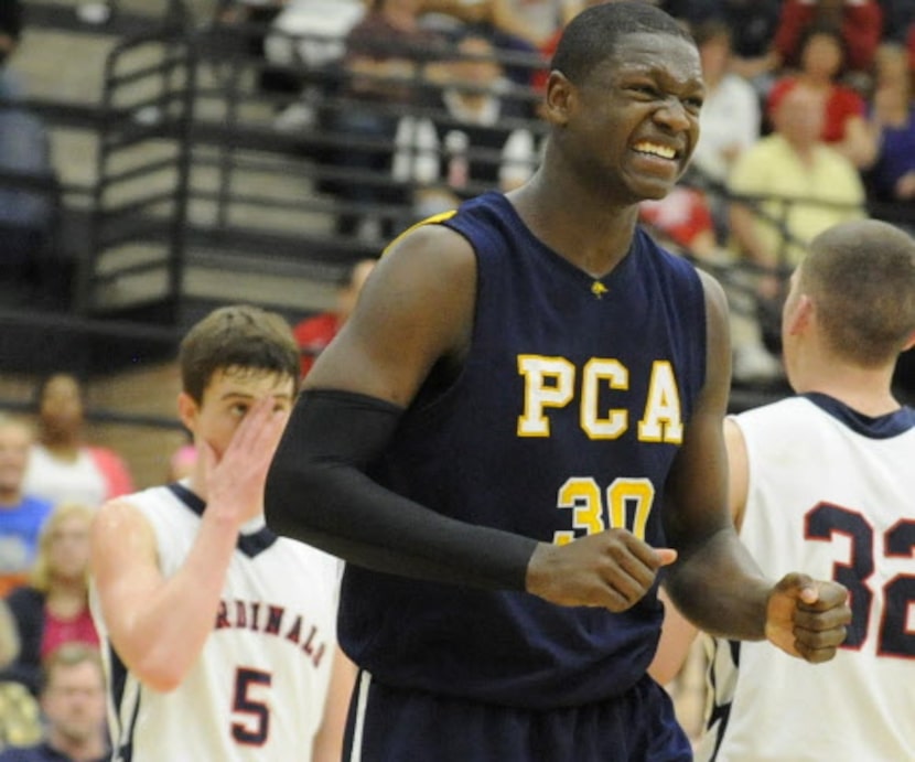 Prestonwood's Julius Randle (30) celebrates after a basket as John Paul II's Kyle Berry...