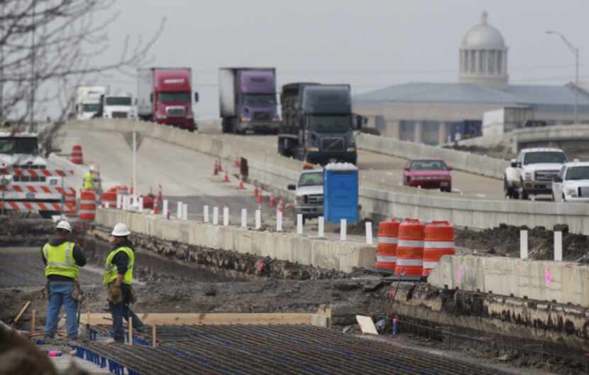 TxDOT crews work on access roads near John King Boulevard and Interstate 30 in Rockwall....